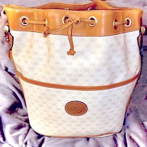 Vintage Gucci GG logo ivory coated canvas drawstring bucket bag.